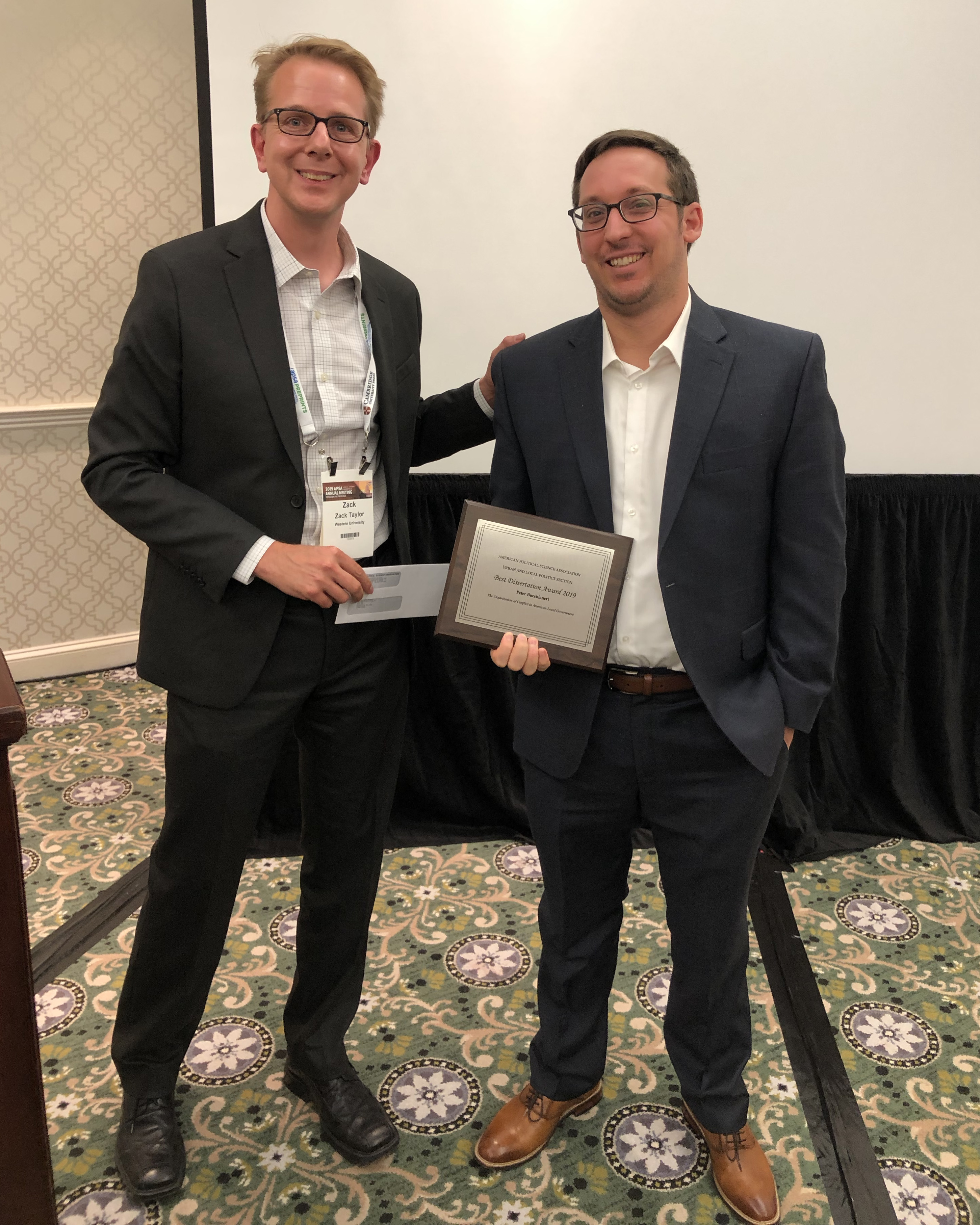 Zack Taylor presents the Best Dissertation Award to Peter Bucchanieri at the 2019 APSA conference.